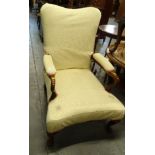 A walnut open armchair in the George III style, the cream damask padded back arm rest and seat