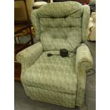 A Celebrity electric reclining chair in green diamond pattern material, 102cm high.