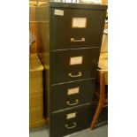 A four drawer metal filing cabinet, 134cm high, 47cm wide, 63cm deep and a lightwood chest of