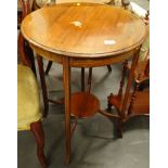 An Edwardian mahogany boxwood strung and chequer banded occasional table, the circular top with
