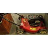 A Briggs & Stratton Quattro 4 horse power Champion rotor mower with 20" cut and grass box.