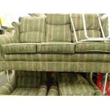 A three piece lounge suite in floral pattern fabric, comprising three seater settee and two