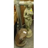 A garden statue of an otter, 33cm high, another classical modern stone figure of a lady semi clad.
