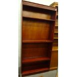 A mahogany finish freestanding finish open bookcase, with removable shelves and dentil top, 194cm