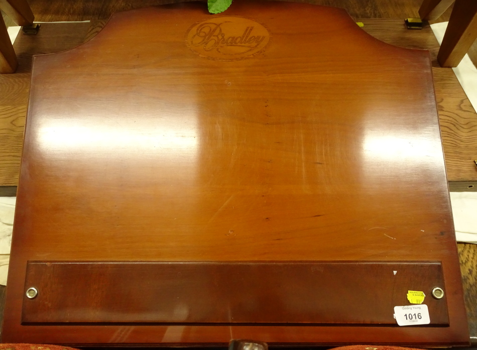 A Bradley yew veneered table top desk or book stand, the hinged lid enclosing a vacant interior,