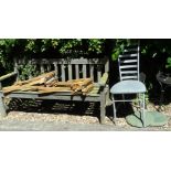 A slatted wooden garden bench, 156cm wide, two folding stools and three various metal garden chairs.