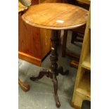 A Victorian mahogany occasional table, the circular top with a moulded edge on turned column and