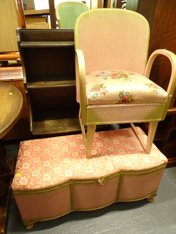 A Lloyd loom style lidded blanket box, with a serpentine front in peach, a similar design chair