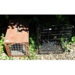 A wooden pet travel cage, 36cm high, 34cm wide, 58cm deep and a further pet travel cage (2).