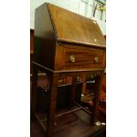 An early 20thC mahogany single bureau with drawer beneath, on square legs, 103cm high, 54cm wide,