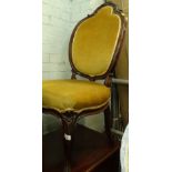 A Victorian rosewood side chair, the cartouche shaped back carved with scrolls, leaves and flowers