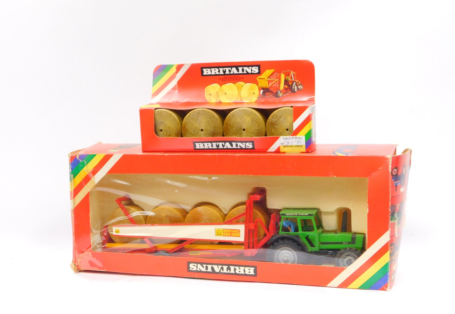 A Britains die cast Dautz-Fahr DX92 tractor with bale transporter, 9602, and a round bales set 1743,