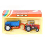 A Britains die cast Massey Ferguson tractor with rear dump trailer, 9587, boxed.