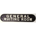 A railway sign 'General Waiting Room,' of oval form, with white raised lettering on black ground,