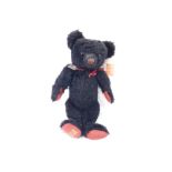 A Merrythought Compton & Woodhouse Penny Red limited edition teddy bear, in black and red with