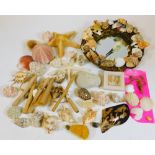 A decorative shell mirror, with plain glass, 34cm wide and various other seashells, etc. (a