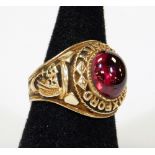 An Oxford University marked ring, with oval red polished stone, size T, marks rubbed.