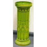 An early 20thC Bretby style umbrella stand, of cylindrical form raised with moulded flowers and a