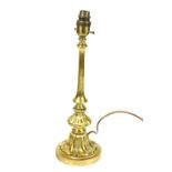 A 20thC brass table lamp, the shaped cylindrical stem with bell flower double stepped base, modern