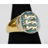 A Three Lions England signet style ring, with oval head on green ground with white stones to the