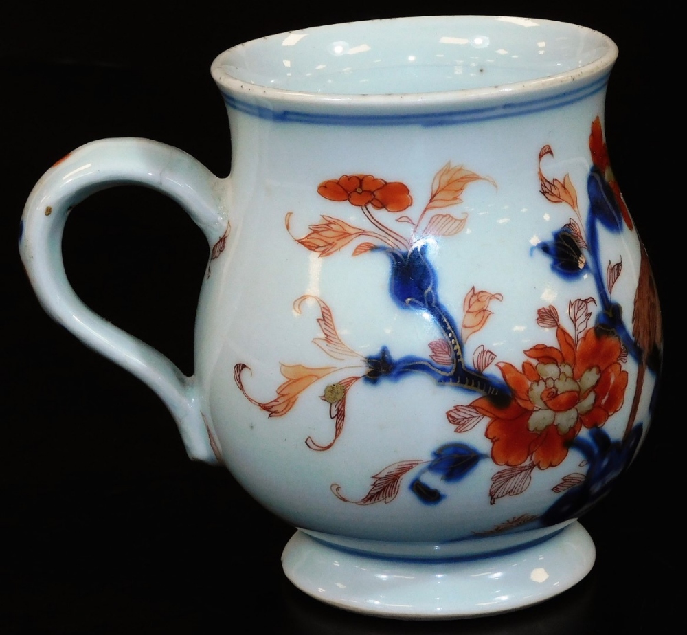 An 18thC Chinese Imari baluster mug with ear handle, predominantly decorated in orange and blue with - Image 3 of 8