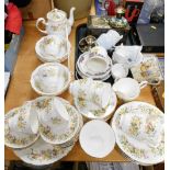 A Colclough floral pattern tea service, to include tea pot 15cm high, various other tea ware, tin,