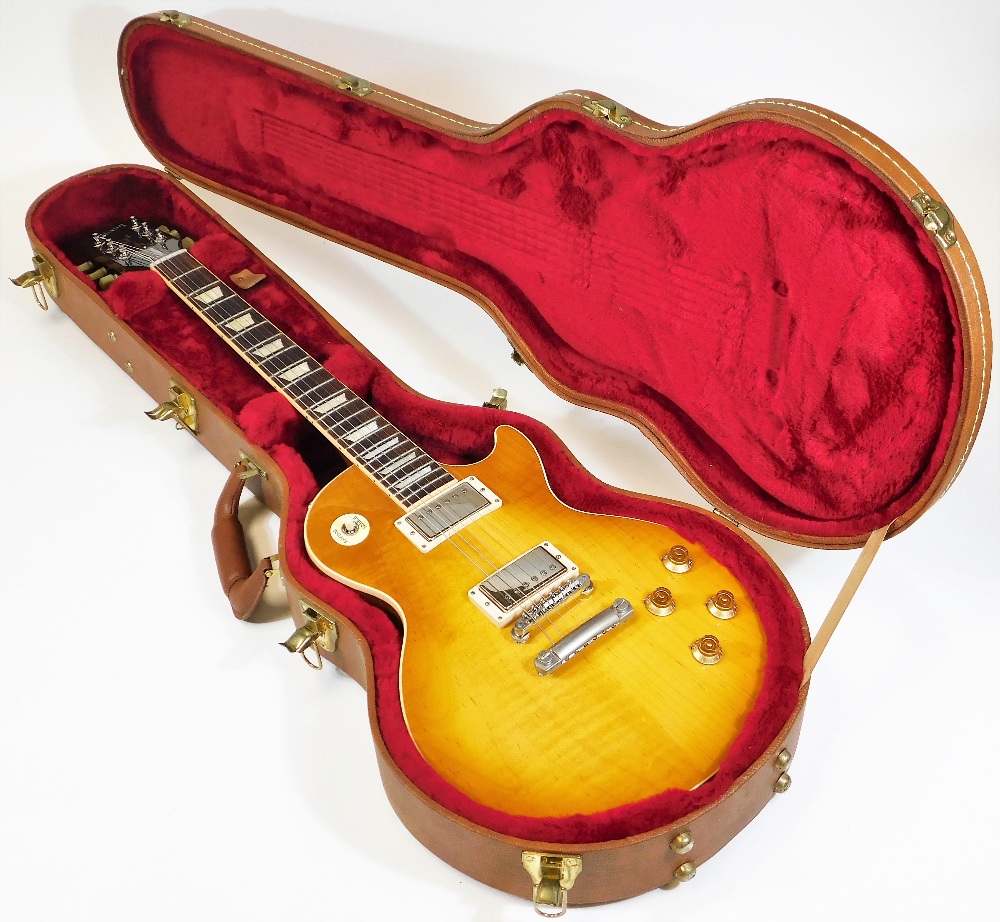 A Gibson Les Paul traditional electric guitar, in honeyburst finish, having twin humbucker