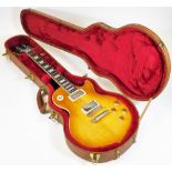 A Gibson Les Paul traditional electric guitar, in honeyburst finish, having twin humbucker