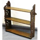 A late Victorian oak hanging shelf, with pierced sides and framed shelves, 50cm high, 60cm wide,