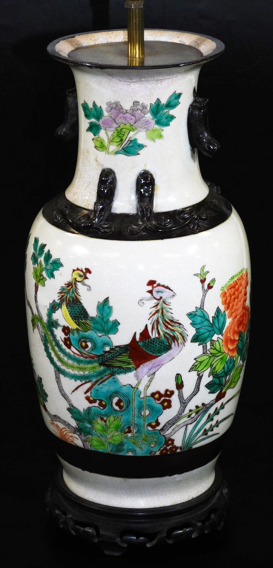 A Japanese pottery lamp vase, of shouldered circular form, polychrome decorated with exotic bird and