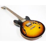 A Vintage AV3 small 335 style semi acoustic guitar, having twin humbuckers, rosewood fret board,