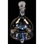 A 19thC glass fly trap jar with stopper, with recess centre section, on shaped feet, 23cm high.