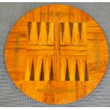 A late 19thC games table top, of circular form with brass inlay and parquetry back gammon board