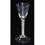 An 18thC air twist cordial glass, with plain bowl, tapering cylindrical stem and domed foot, 15cm