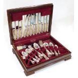 A canteen of silver plated Flexfit cutlery, shell capped King's pattern, in walnut veneered canteen,
