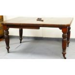 A mid 19thC extending dining table, with canted top on turned legs terminating in castors, 70cm