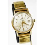 A Movado automatic 28 jewel wristwatch, with baton numerals and pointers and Arabic date aperture,