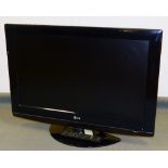 An LG 32LG5010 80WRJCOG100 colour television in black trim, with remote control and wire.