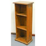 A late 20thC oak narrow open bookcase, of rectangular form with three shelves, 97cm high, 41cm wide,