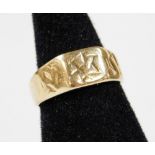 A 9ct gold ring, with shaped band and star emblem, size M, 4g.