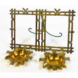 A pair of early 20thC brass ash trays, each of shaped form with scroll outline broken by imps,