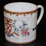A 19thC armorial porcelain cup, by Samson of Paris, decorated with a coat of arms with the Cnock