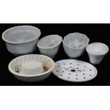 Various pottery jelly moulds, etc., a Grimwades oval pierced liner, 21cm wide, jelly mould with