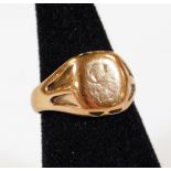 A 9ct gold signet ring, partially engraved with shaped shoulders, size P, 5.5g.