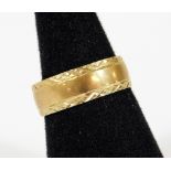 A 9ct gold band, of textured form, size Q, 3.4g.
