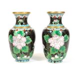 A pair of 20thC cloisonne vases, each of shouldered form decorated with flowers predominately in