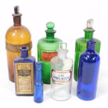 Two green glass poison bottles, etc. and other brown glass pharmaceutical bottles and a small