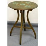 A Victorian poker work table, with circular top set with flowers, on inverted sabre legs joined by a