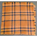 A Welsh woollen rug in checked brown and blue pattern, 175cm x 175cm.