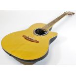 An Applause by Ovation bowl back acoustic guitar, having inlaid sound hole, rosewood board and